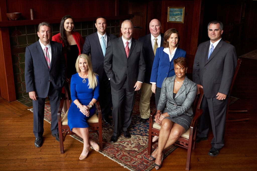 Group shot of corporate professionals in business attire