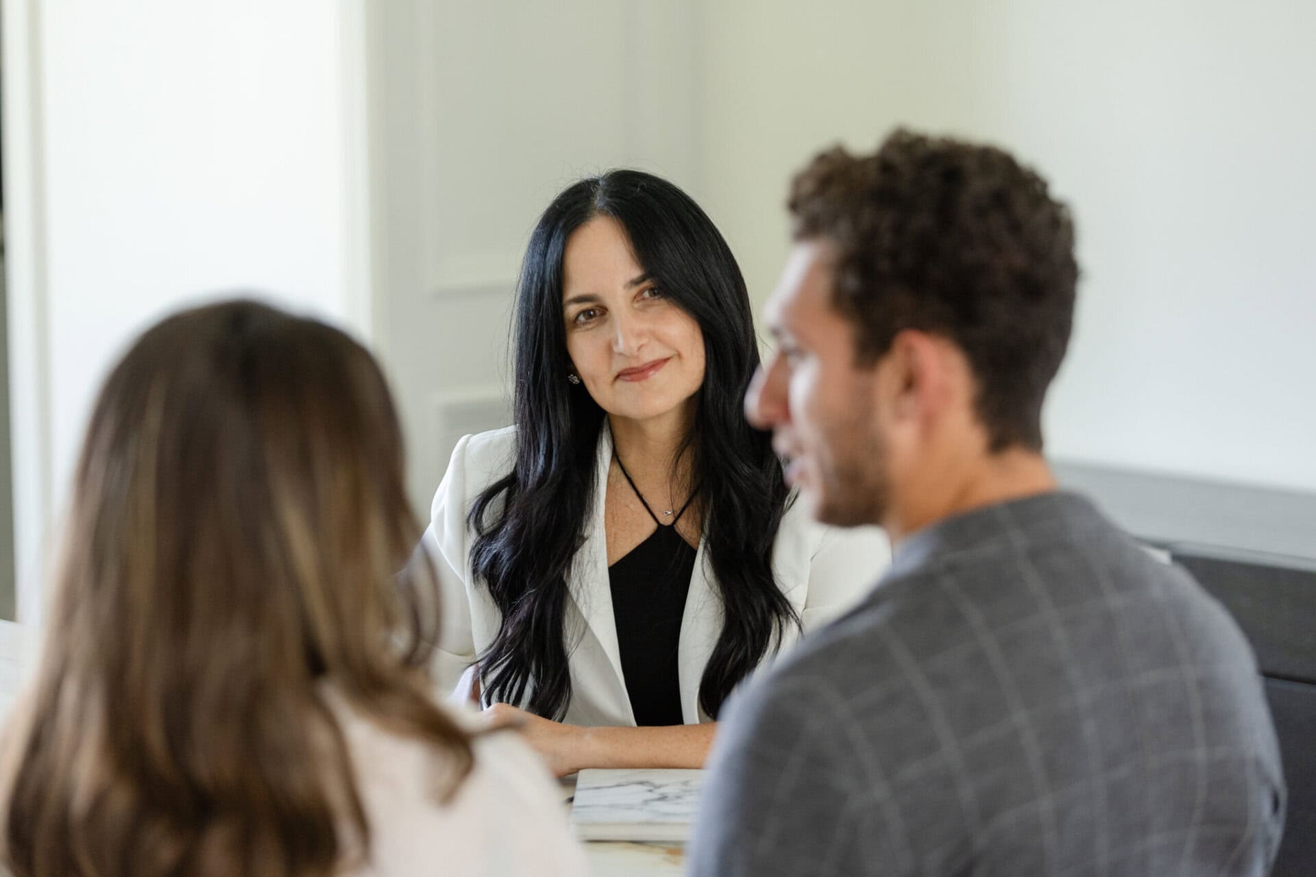 Client interaction A woman at a desk interacting with clients