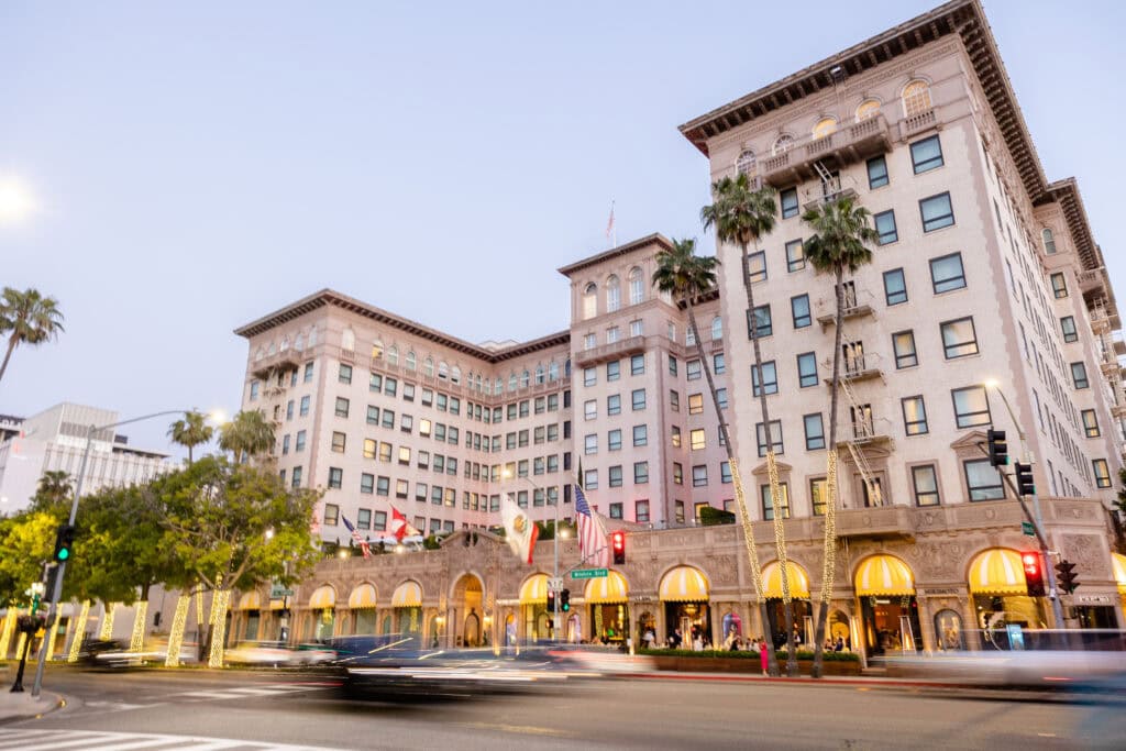 Hotel building street view, with moving traffic in front