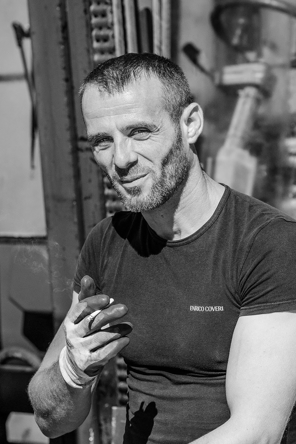 Portrait of a construction worker smoking a cigarette.