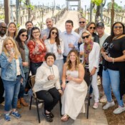 Group of people posing at a winery